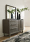 Arkenton California King Panel Bed with Mirrored Dresser, Chest and 2 Nightstands