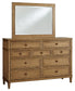 Sharlance California King Upholstered Panel Bed with Mirrored Dresser